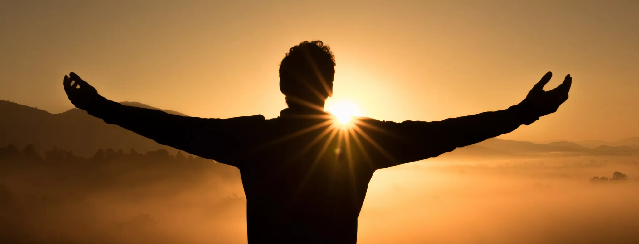 Photo of sunrise with man posing in an embrace